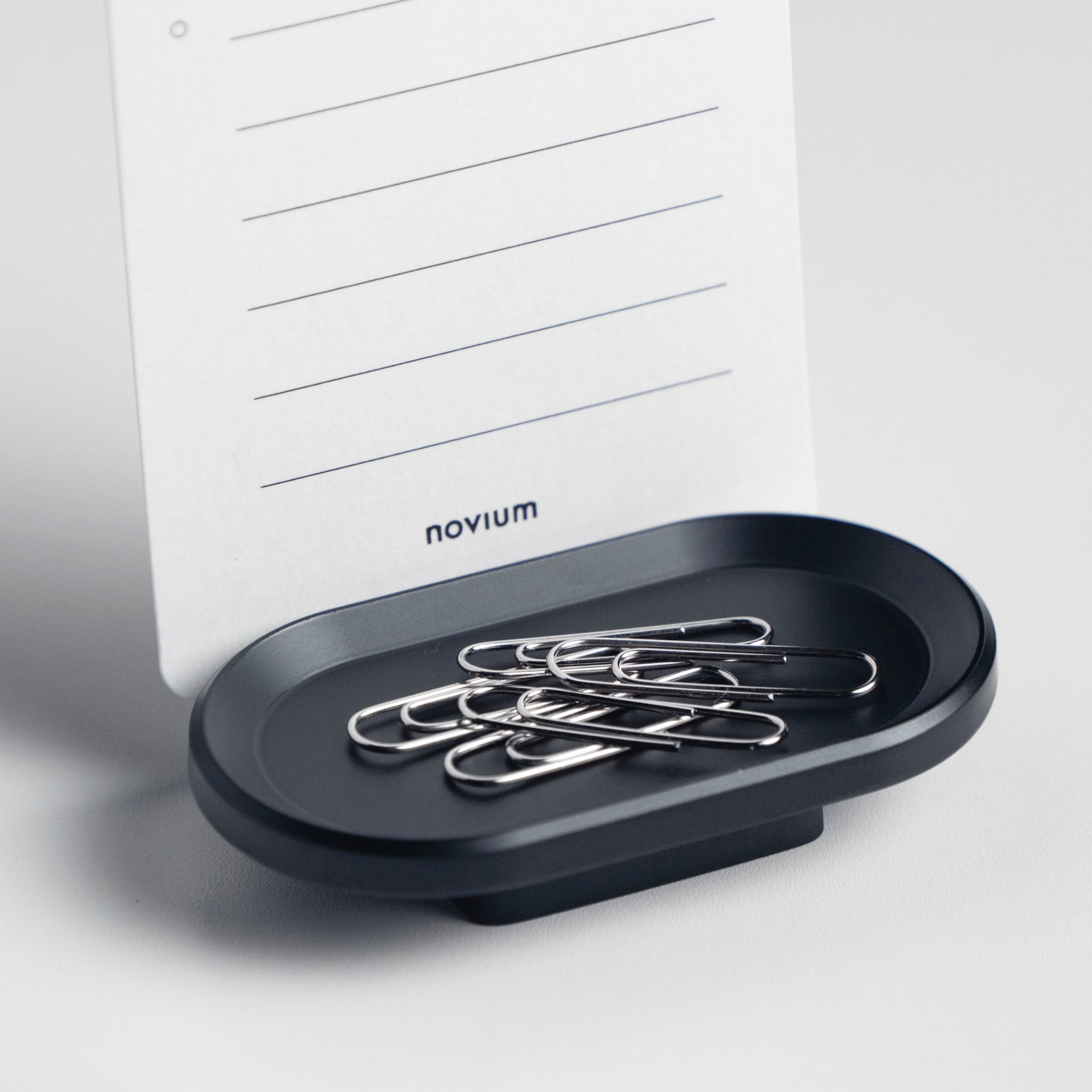 novium card holder holding a to-do list card, the to-do list features nine lines for tasks and is branded with "novium" at the bottom